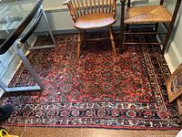 Full view of rug under desk and chairs showing overall design