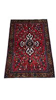 Full view of the handmade exotic Persian rug showing central Christian cross and floral patterns