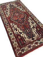 Angled view of full rug showing central medallion and color palette