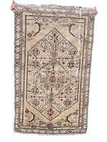 Front view of vintage Persian wool rug showing overall design with geometric central medallion and floral motifs in earth tones.