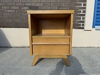 Front view of the nightstand showing drawer and open shelf