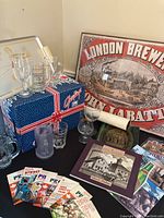Photo showing various Labatt branded items including glassware, box, steins, and framed London Brewery poster