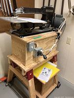 Overall view of scroll saw mounted on universal mobile base