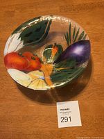 Top view showing the full bowl with painted vegetable design on bubble textured crystal surface.