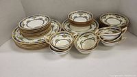 All pieces displayed: dinner plates, large and small side plates, small bowls, cups and saucers