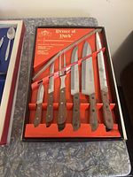 Prince of York cutting tool set in original box with six knives of various types and wooden handles.