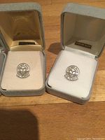 Two TTC years of service pins in individual boxes, labeled 10 year and 15 year respectively.