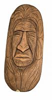 Front view of the carved wooden face wall hanging showing carved details of hair and facial features.