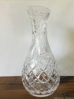 Front view of crystal carafe showing diamond cut pattern and neck design