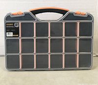 View of the 18-inch Toolway toolbox and organizer showing its closed lid with compartments visible through the transparent cover, black handle, and orange clips.