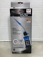Front view of Protorch Self Igniting Torch Kit packaging showing the product image, brand, and key flame and safety info.