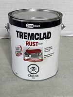 Front view of the 3.78L Tremclad gloss black rust paint can showing label and branding.