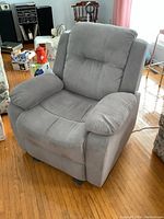 Grey upholstered power recliner front angled view