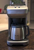 Front view of the coffee maker with carafe in place