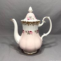 Front-side view of the Royal Albert Bridesmaid coffee pot showing pink floral design and gold trim