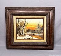 Full framed oil painting showing the winter landscape and signature, displayed upright