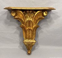 Front view of vintage Italian Florentine wall sconce showing ornate gold leaf detailing and top platform.