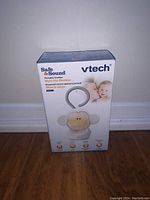 Front view of the Vtech Safe & Sound Portable Soother box showing the Myla the Monkey design and product name.