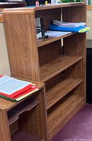 Photo showing adjustable 4-shelf bookcase and smaller companion adjustable paper storage unit with stacked folders and papers on shelves.