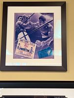 Framed artistic blue-toned Muhammad Ali boxing print with two attached boxing event tickets from fights including Ali vs Norton.