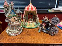 Overview of all three music boxes on wooden table