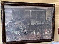 Full view of the large framed vintage Oriental print showing travelers on horseback amidst mountains, housed in a dark antique wooden frame.