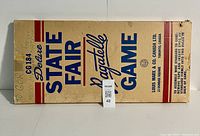Box of the 1950's Marx Deluxe State Fair Bagatelle game showing front and side with large print branding and assembly instructions.