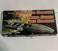 Box cover of Battlestar Galactica board game with spaceship artwork and title in English and French.
