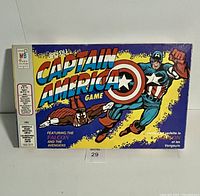 Front cover of the vintage Captain America board game box with colorful comic artwork showing Captain America and the Falcon in dynamic poses.