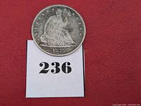 Obverse side of 1875 Seated Liberty Half Dollar showing seated Liberty figure with date 1875.