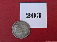 Reverse of coin showing quartered cross of castles and lions with legend '1757 HISPANIARUM REX'.