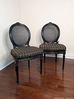 Front view of pair of chairs showing frames and cushions