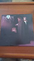 Front of the Stevie Nicks vinyl album showing the title and image of three women in dark clothing against a black-purple background.
