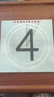 Front cover of Foreigner 4 vinyl album showing band name and large number 4