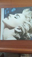 Front cover of Madonna True Blue album showing portrait of Madonna.