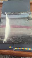 Front and back gatefold panels of the Wings Over America 3LP vinyl album showing airplane design and text details.