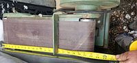 Photo of the 6-inch wide sanding belt with measuring tape showing length of approximately 24 inches.
