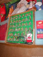 Close-up of vintage set of 40 Christmas bell lights in cardboard box with string attachment and plug