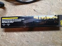 Photo showing the closed box of the Cabela's camping cot with branding and model details.