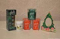 Glade and other scented candles with holiday scents plus Christmas tree tealight holder