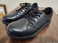 Side angled view of black Dakota WorkPro work shoes showing leather texture and laces.
