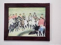 Photography print showing a group of horsemen in traditional attire during a Buzkashi game.
