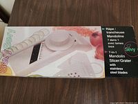 Box exterior showing Sevy branding and listing 7-in-1 functions with stainless steel blades