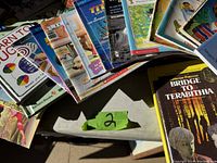 View of assorted children's learning and reading development books arranged in a semi-circle, showing various colorful covers and titles.
