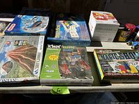 Overview of multiple educational and construction kits including Erector, K'NEX, BrainBox, Magic School, Smithsonian, and others.