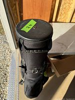 Top view of the golf travel bag showing padded top cover and securing straps.