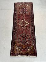 Full-length view of runner rug laid flat on concrete floor
