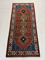 Full view of the runner rug showing overall geometric medallion field and border