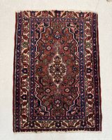 Full view of the rectangular Persian Hamedan rug showing pattern and condition.