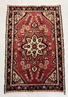 Full view of the hand knotted Persian rug showing its overall design and color scheme